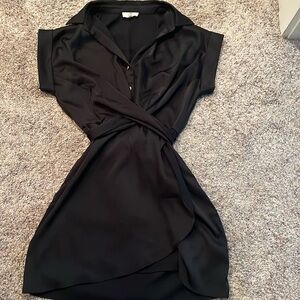 Size small boutique black faux wrap dress.  Worn once.